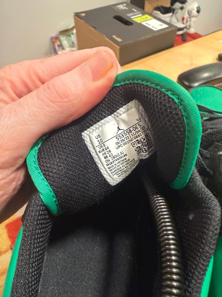 Inside shoe label showing Jordan branding, size 10, and style 553558 065